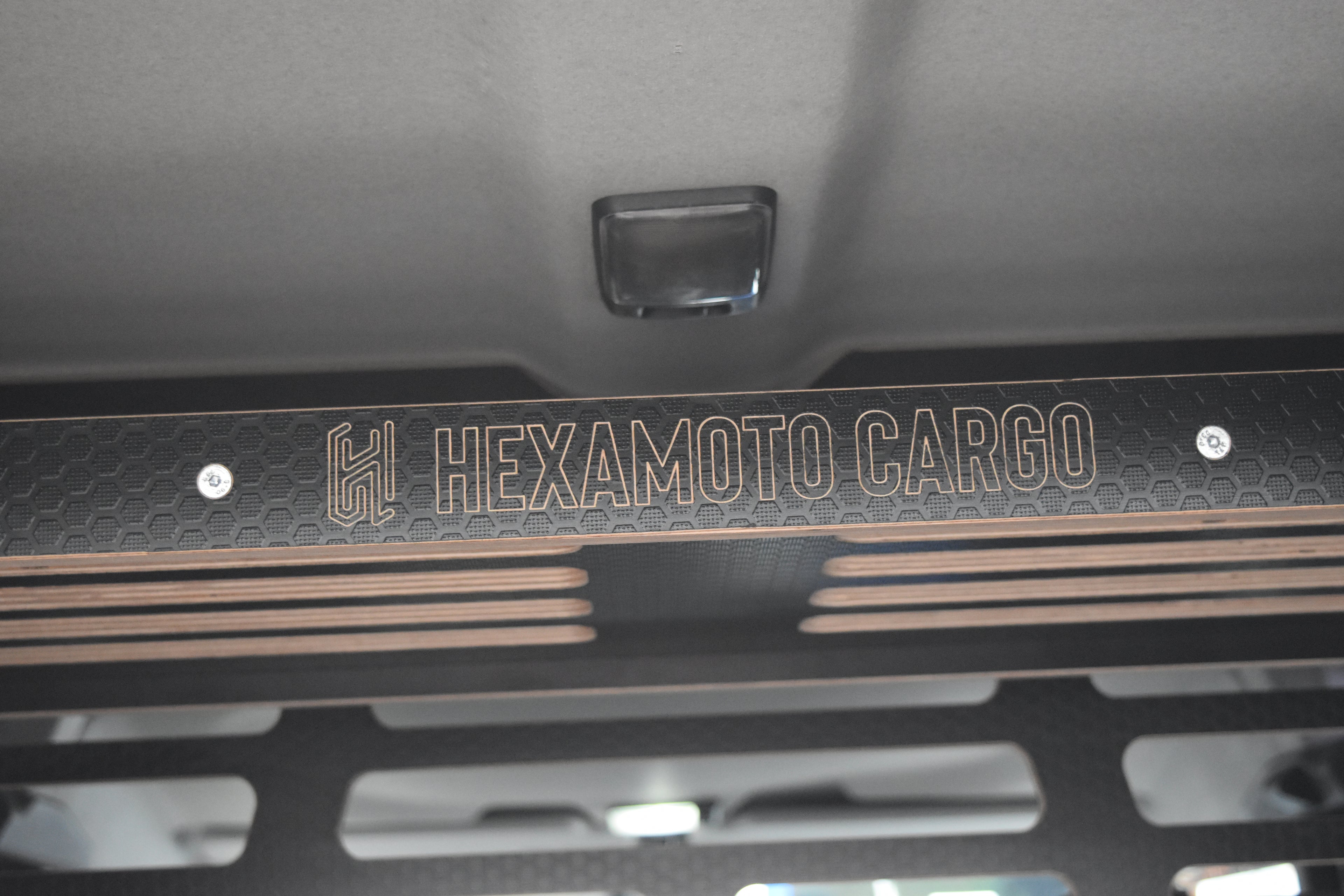 Hexamoto Cargo logo on a wooden surface
