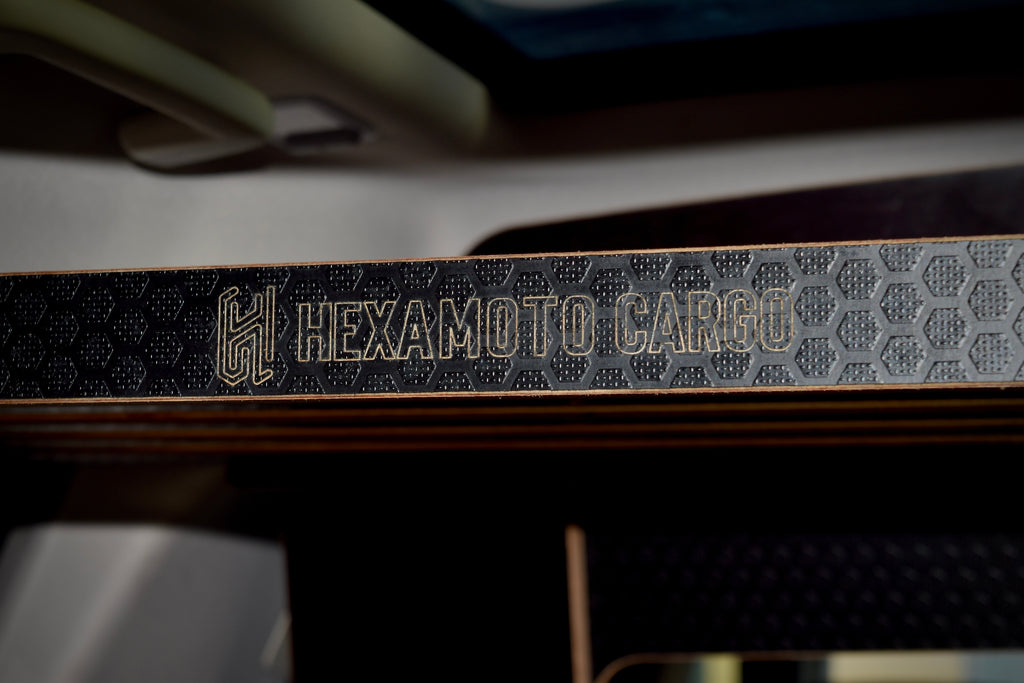 Hexamoto Cargo logo on a textured surface