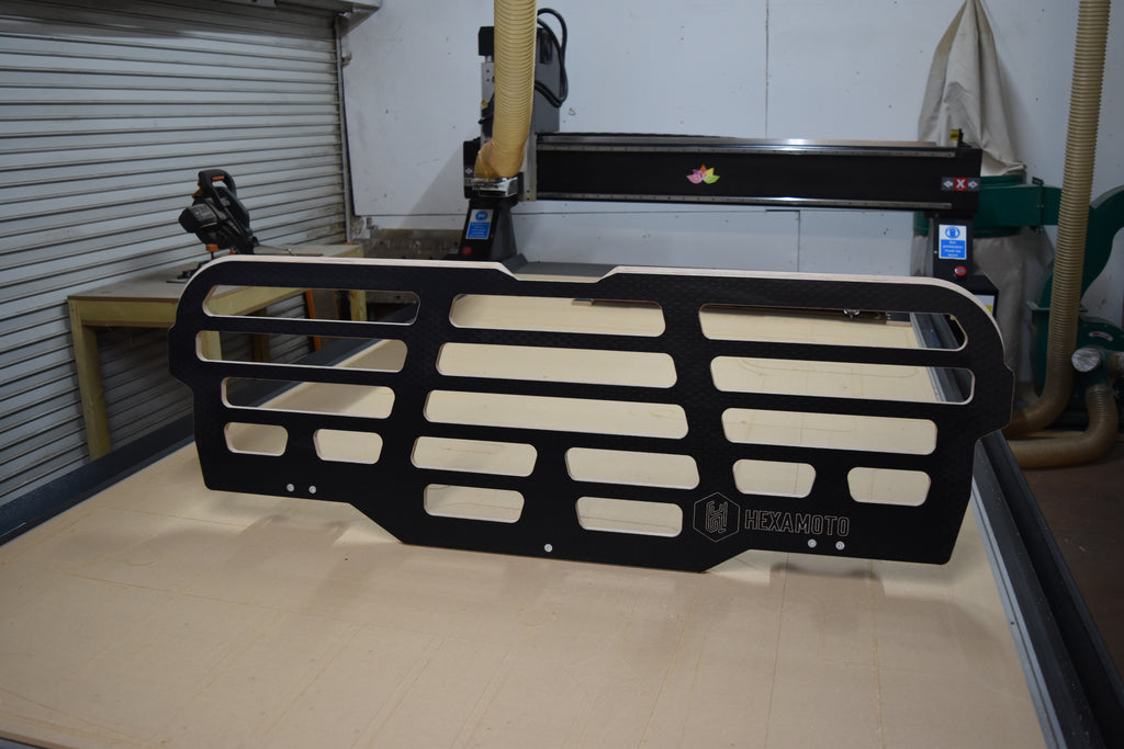 CNC machine with the Hexamoto Dog Guard sat on top of the bed