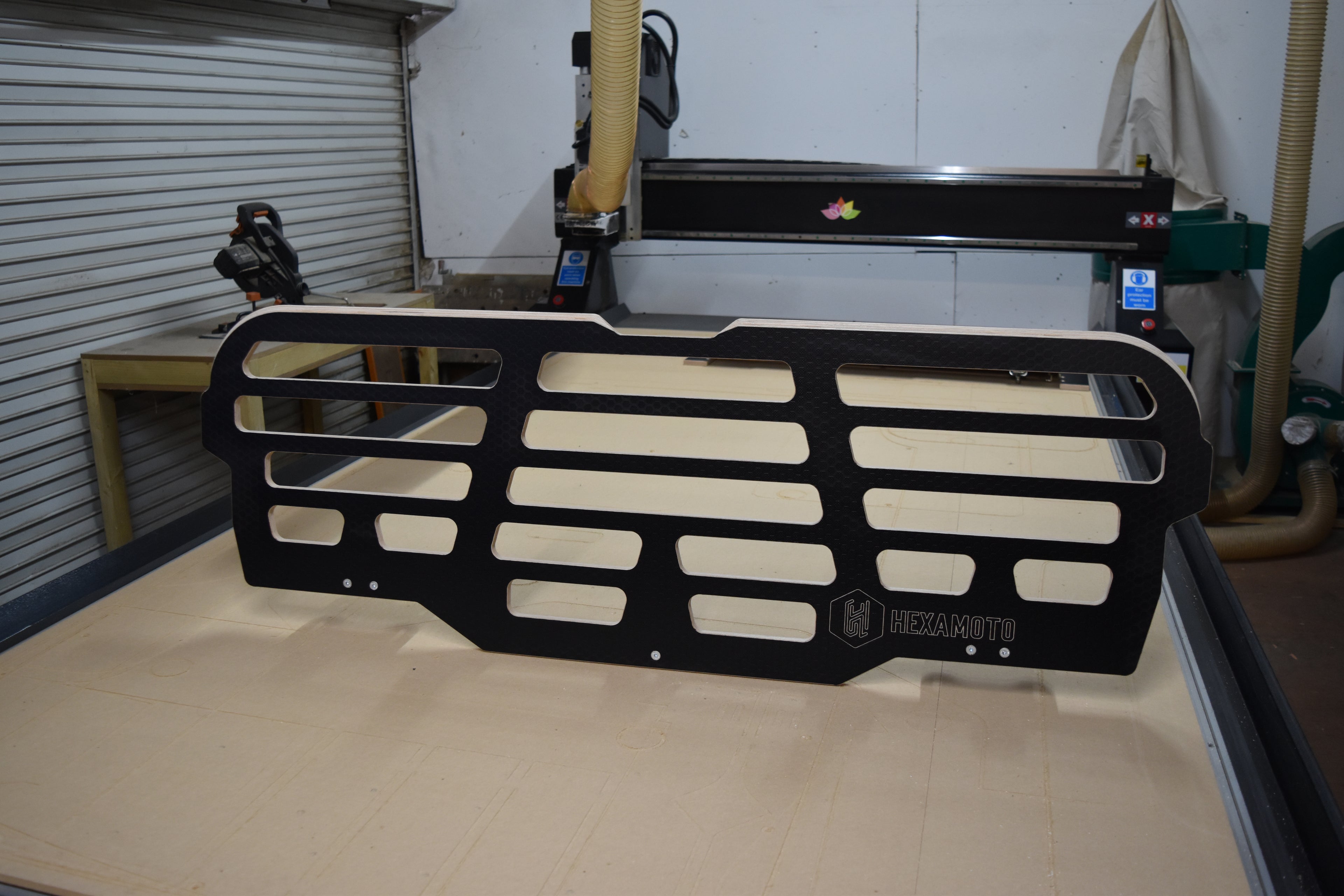 CNC machine with the Hexamoto Dog Guard sat on top of the bed