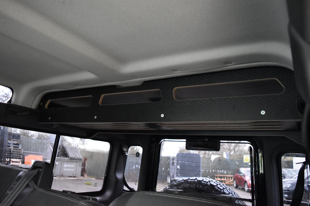 Car interior with a cargo storage system fitted