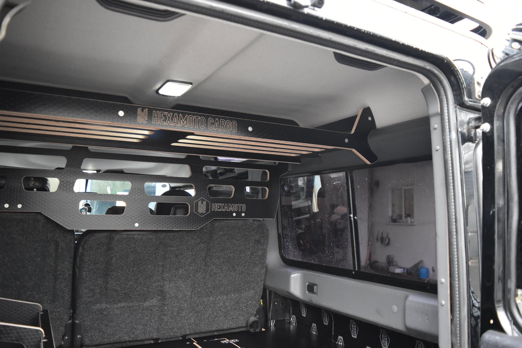 Defender interior with storage racks and organised items