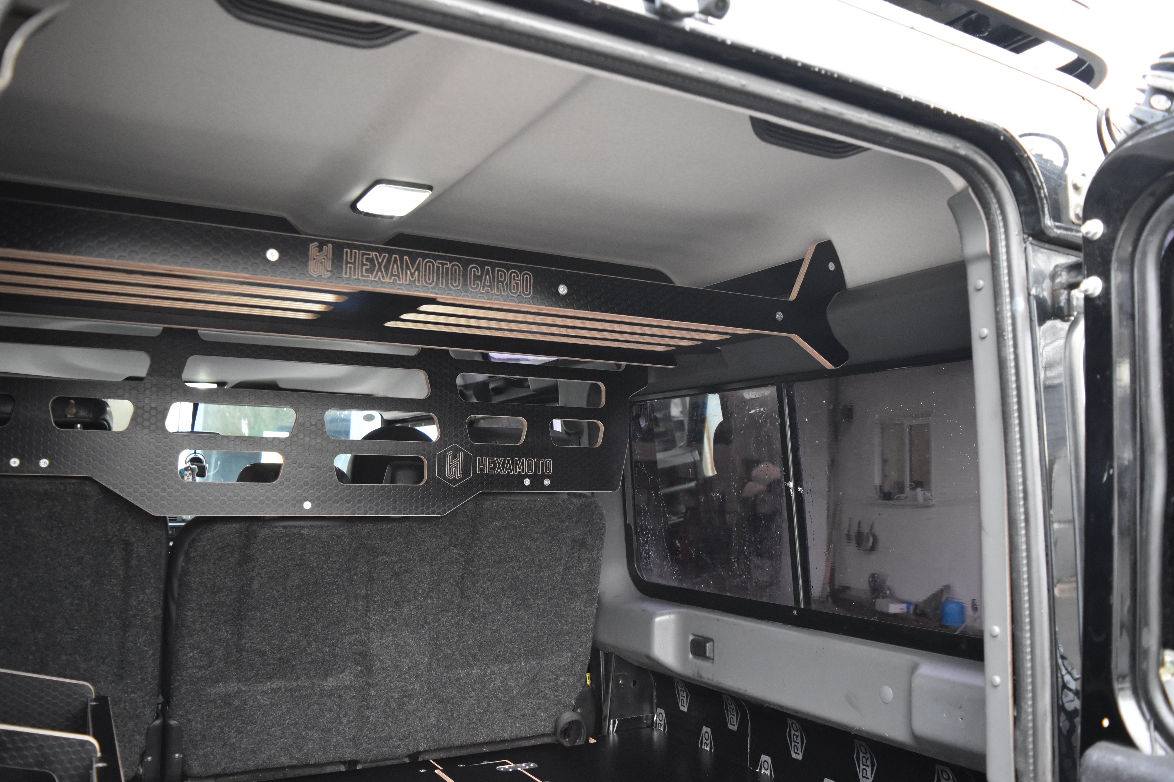 Defender interior with storage racks and organised items