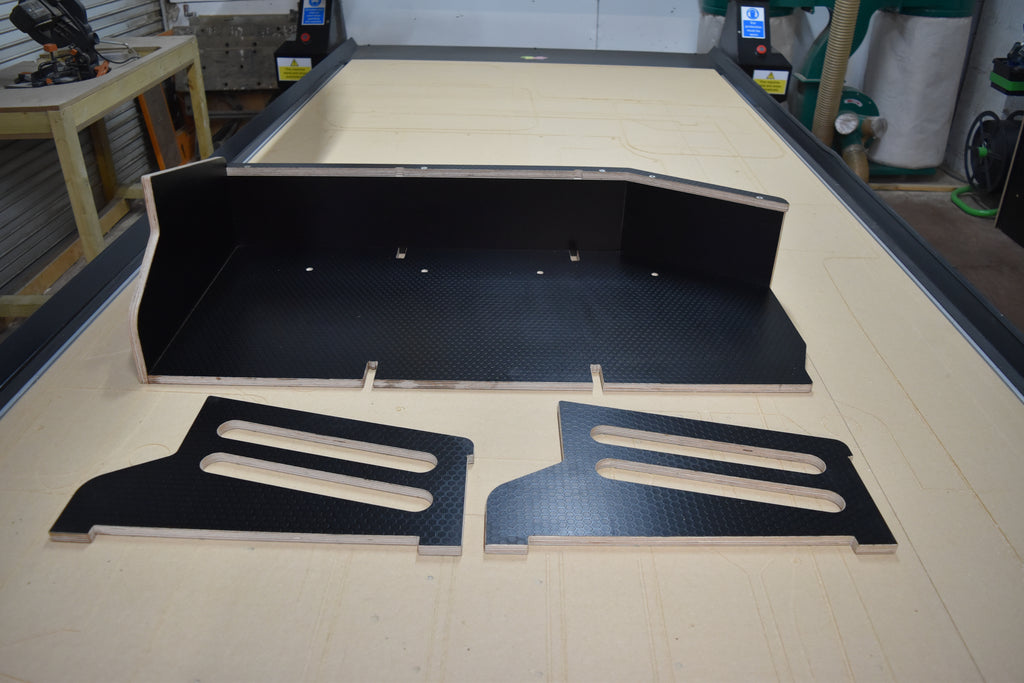 Defender Utility storage basket laid on CNC bed with dividers removed