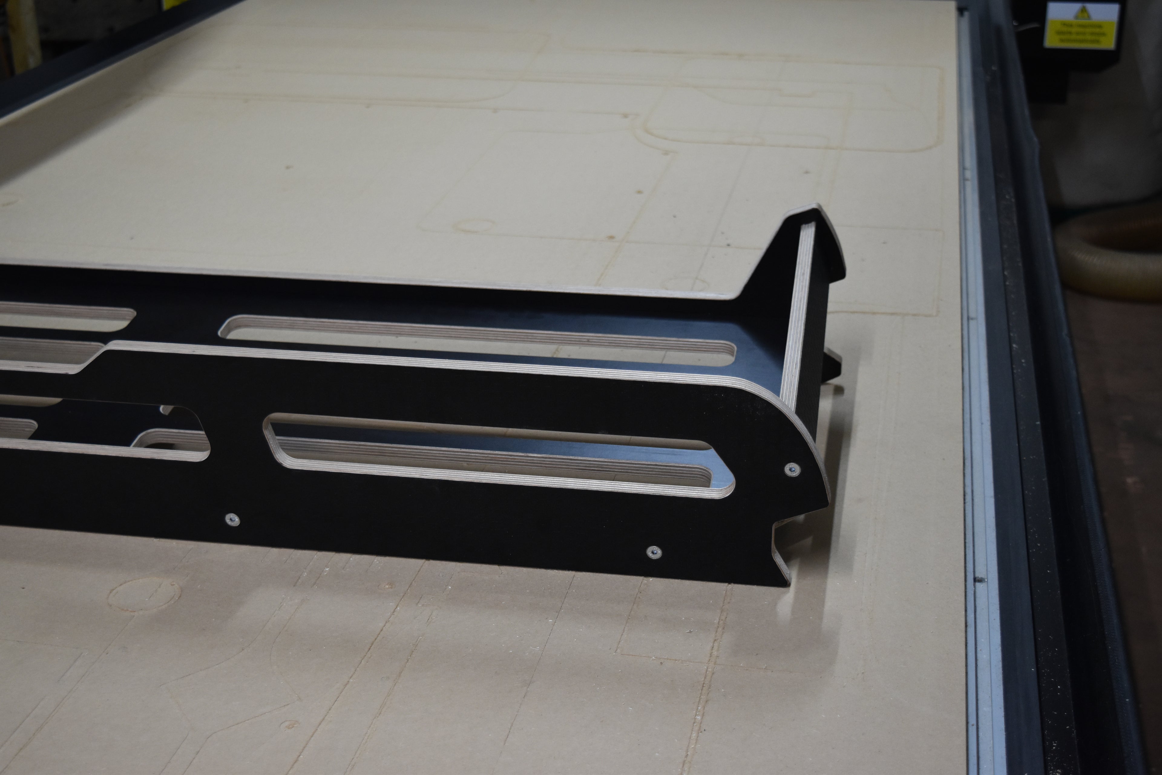 Hexamoto Defender Cargo System on CNC bed, showing one side