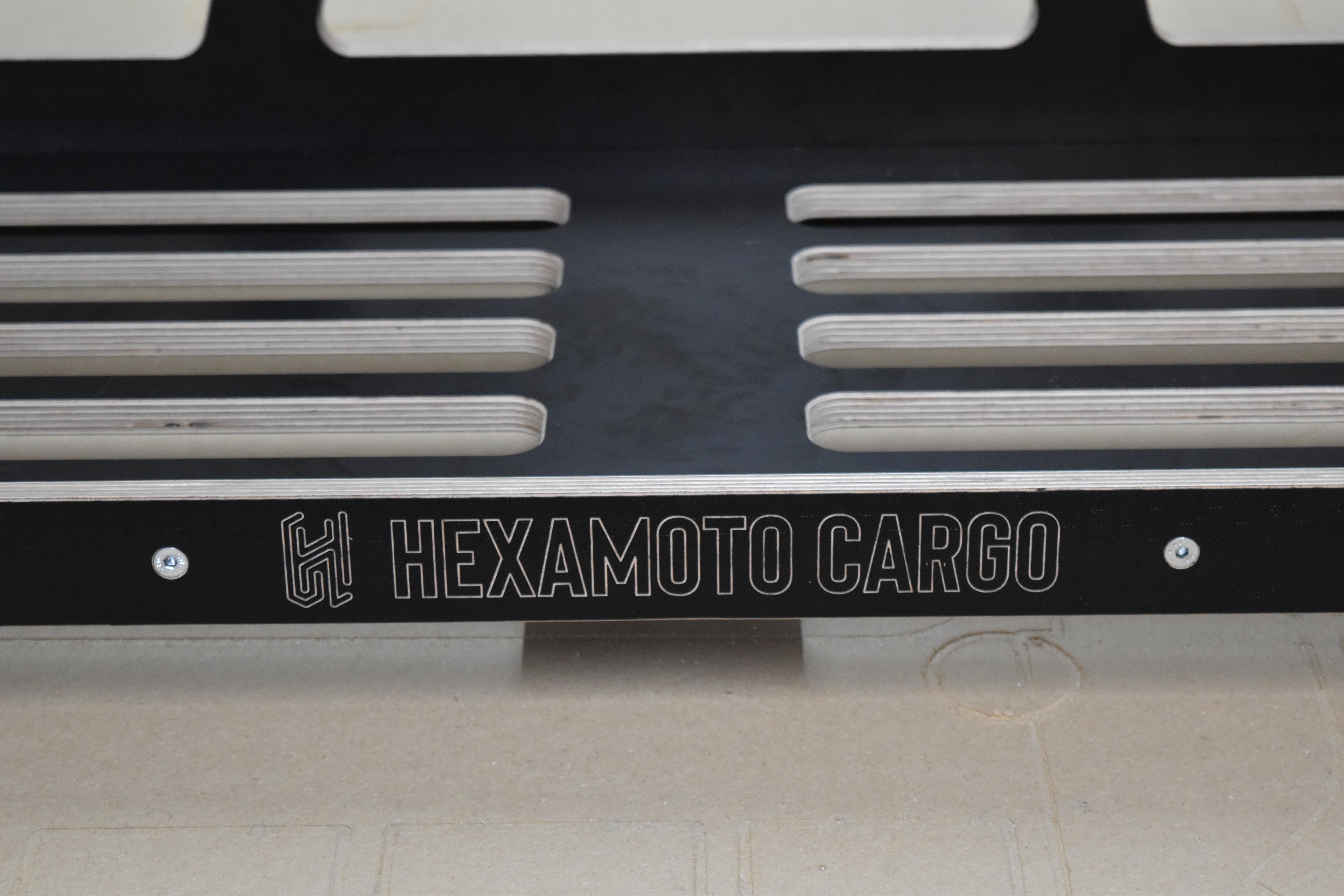 Hexamoto Cargo logo on Defender Cargo 