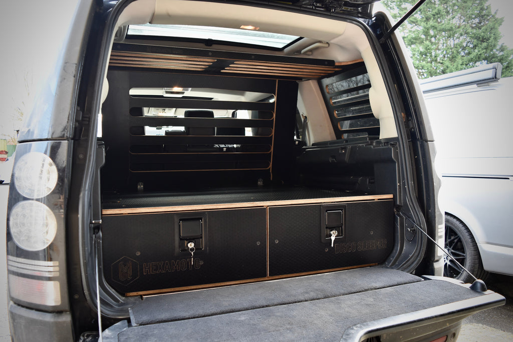 Back of a Land Rover Discovery showing drawer system and cargo storage from Hexamoto