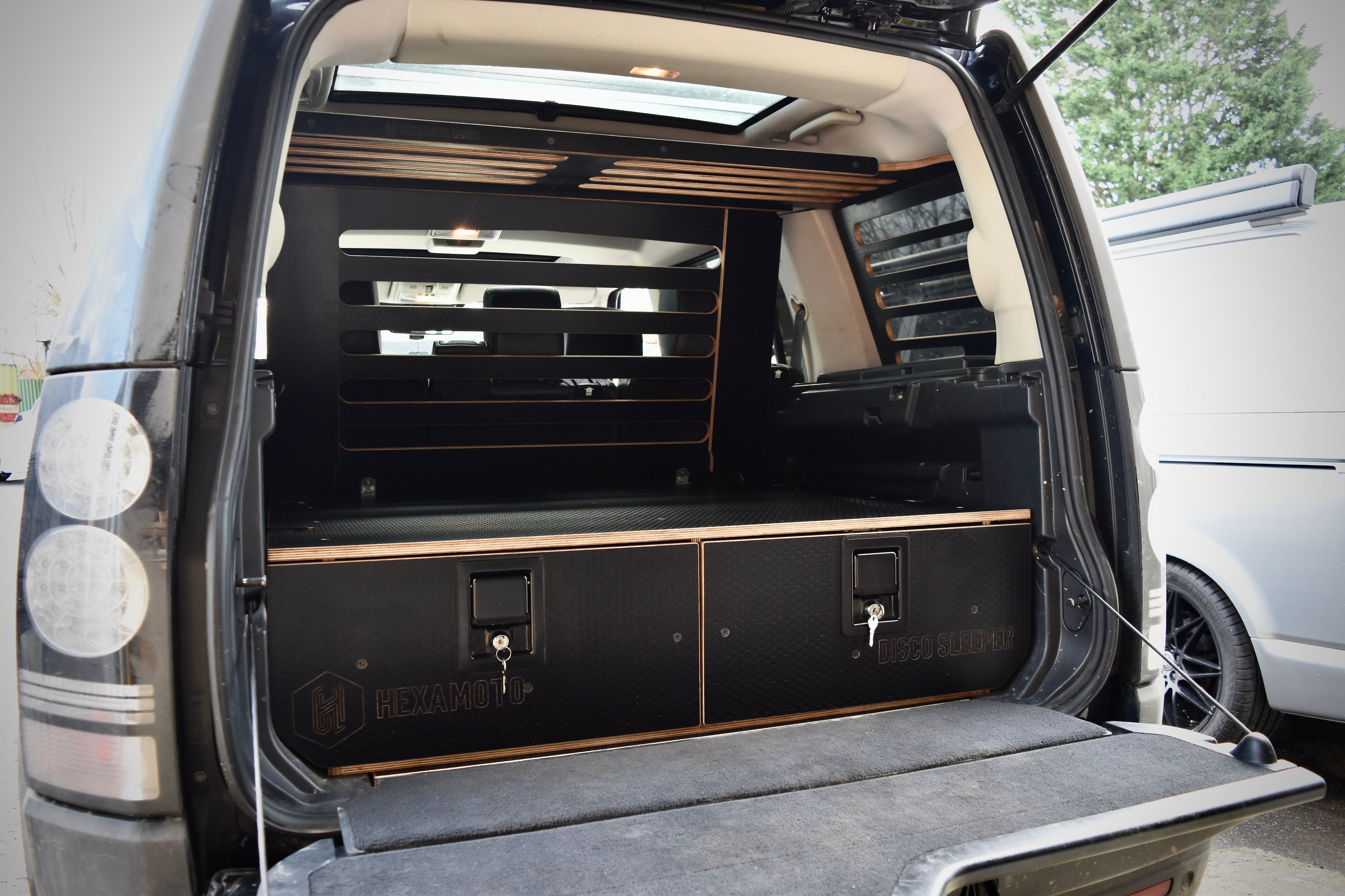 Back of a Land Rover Discovery showing drawer system and cargo storage from Hexamoto