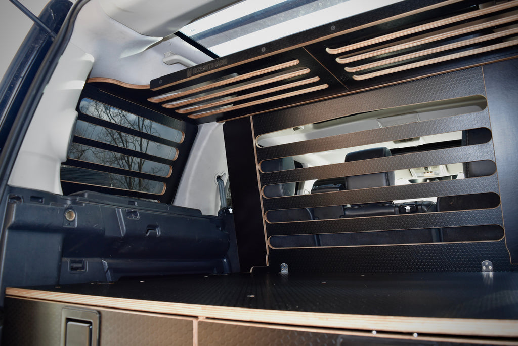 Car interior with wooden storage racks and storage compartments