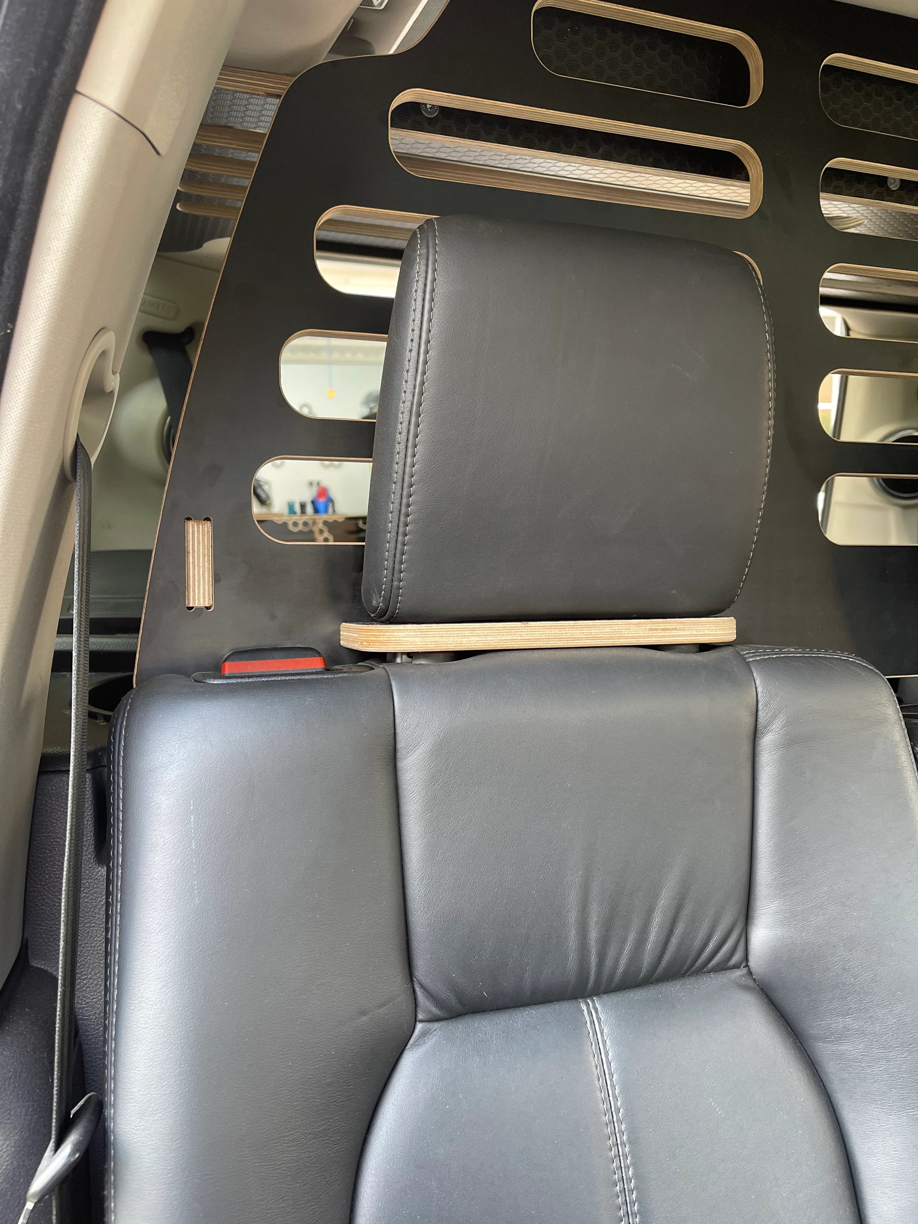 Black leather seats with Hexamoto Dog Guard installed, attaching to the headrests