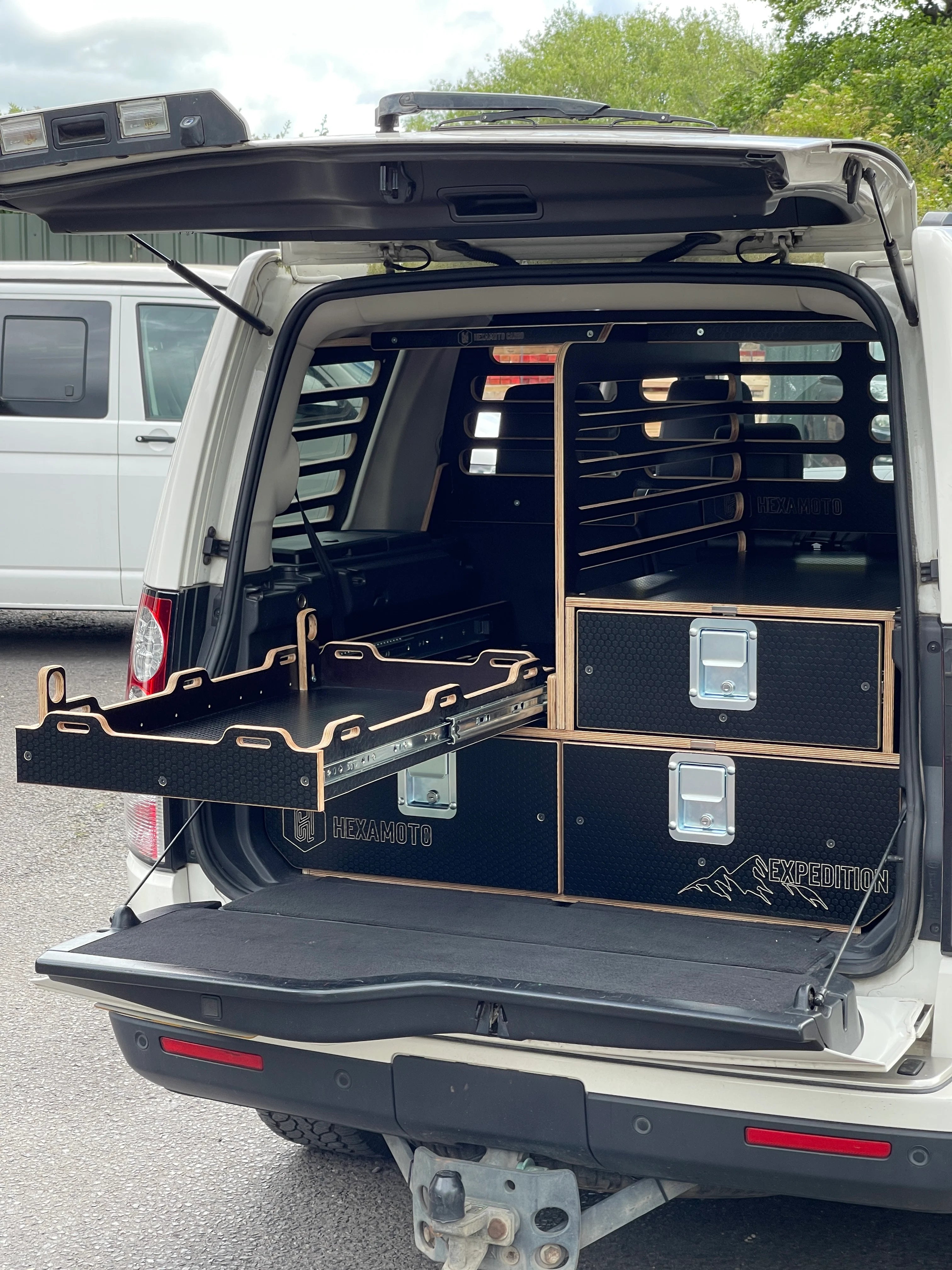 Land Rover Discovery truck with storage system to the rear