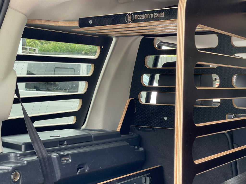 Car Interior with Hexamoto products and logo on the Cargo Storage System