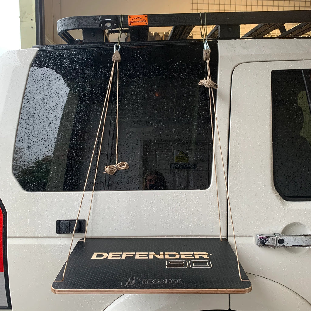 Car hanging table with Defender 90 branding