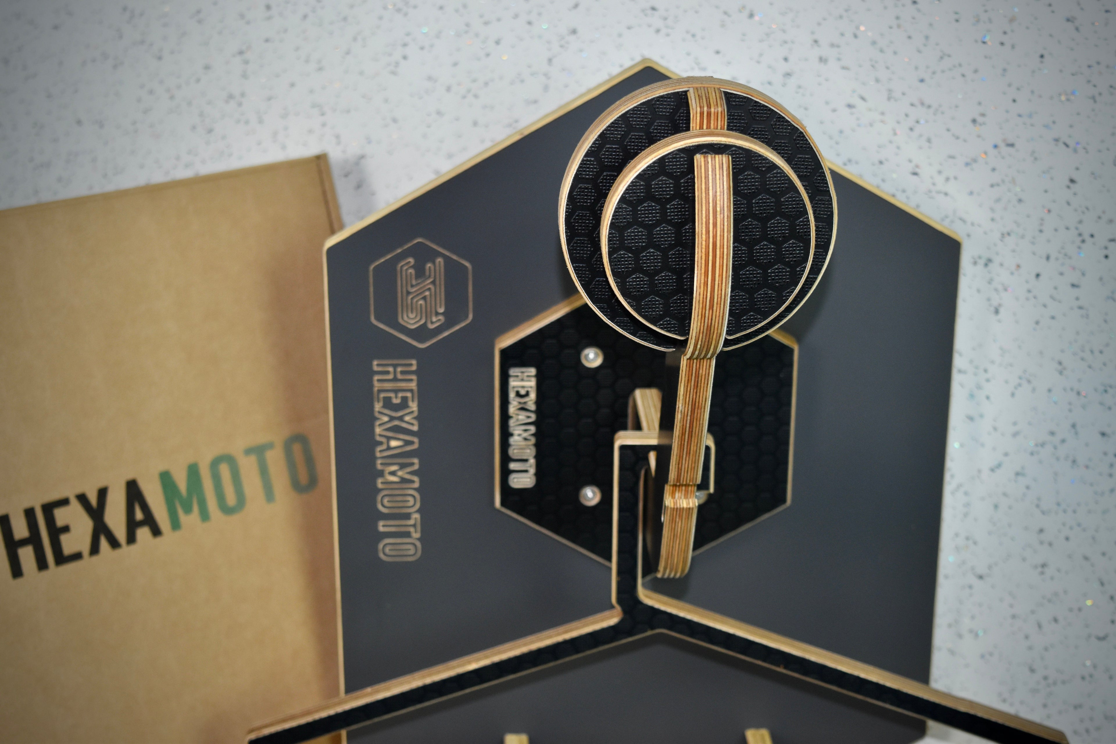 Hexamoto Mini helmet mount section with a branded box in the background