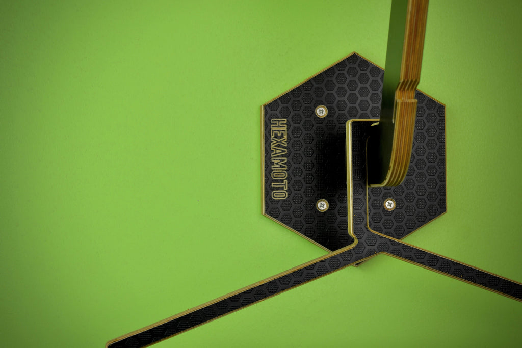 Wall mounted hanger system with 'Hexamoto' branding