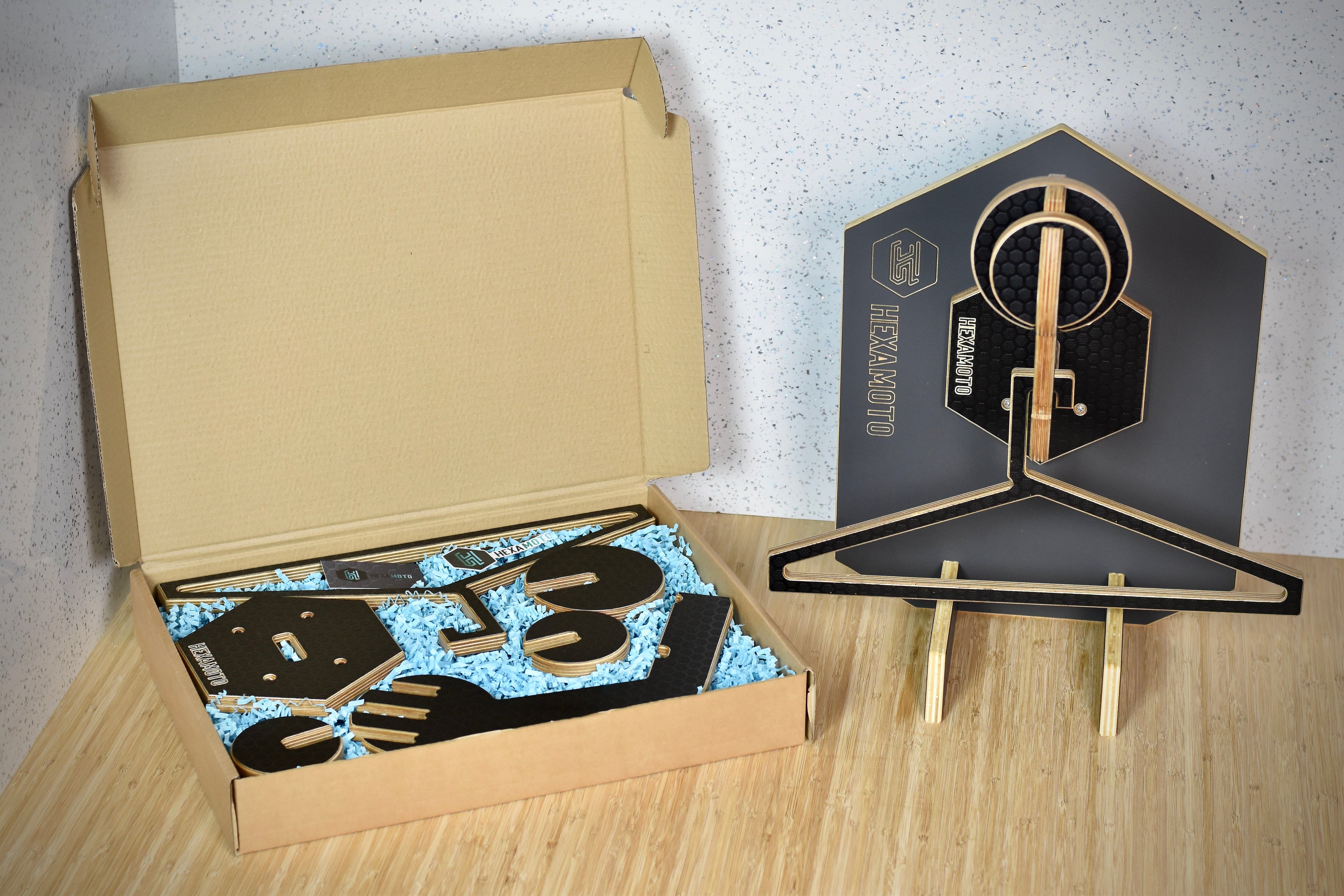 Helmet hanging system with delivery box displayed next to it
