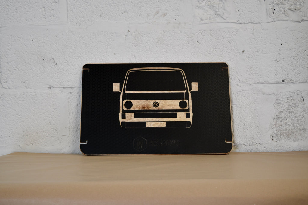 Wooden table with a car design on a white brick wall background
