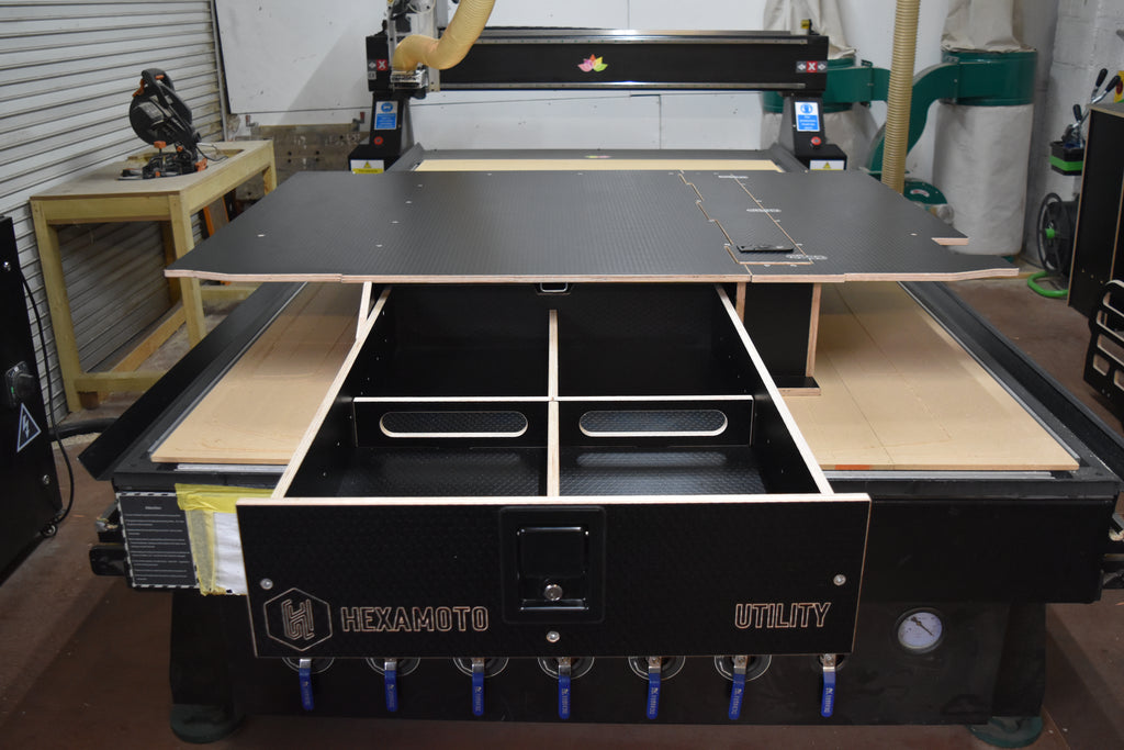CNC machine with Utility storage system, on the bed with drawer open