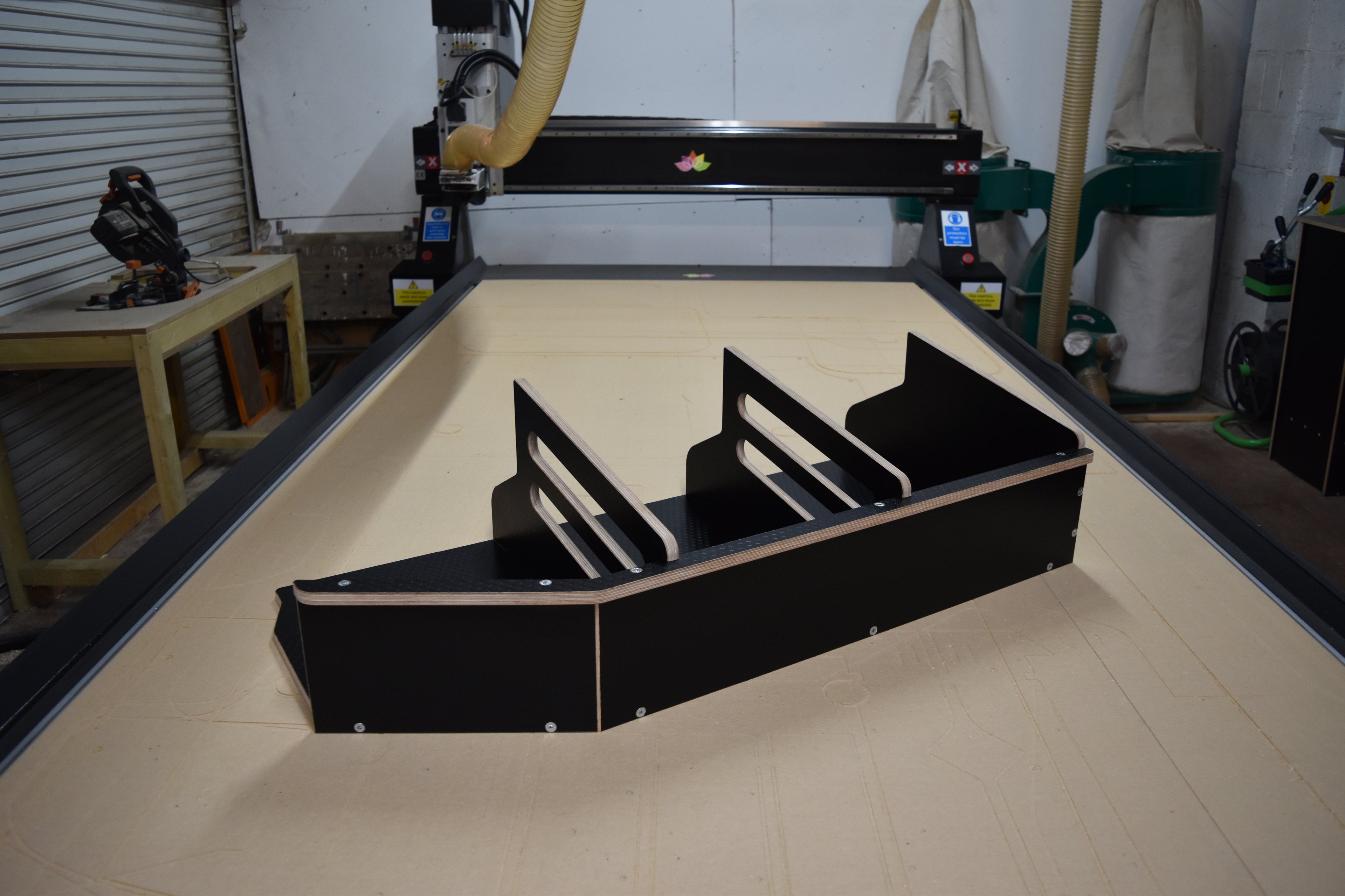 The Hexamoto Utility Basket fully assembled and laid on a CNC machine