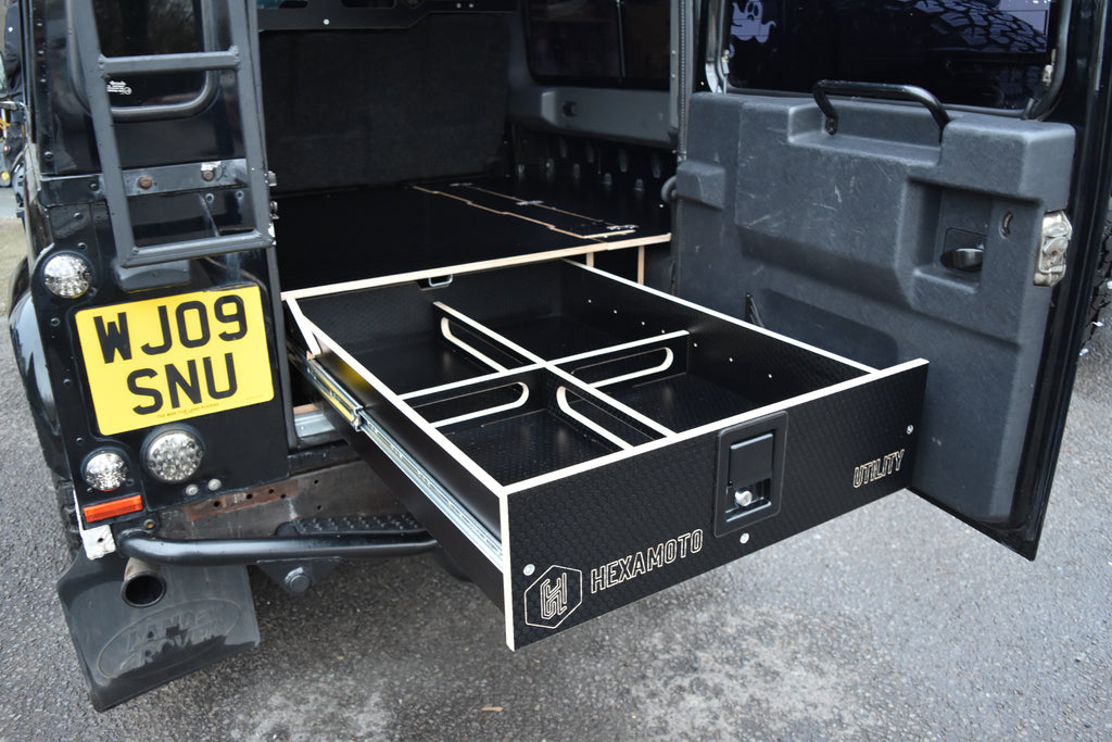 Open storage drawer on a Defender 110 sporting the Hexamoto Utility System