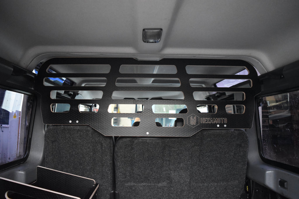 Black wooden Dog Guard fitted in Defender 110